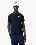 เสื้อโปโลผู้ชาย ULTRA DRY BADGE ACCENT TENNIS HERITAGE POLO SHIRT (Navy Blue / White • HHW)