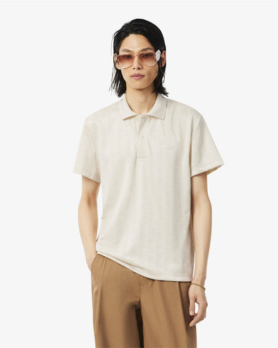 เสื้อโปโลผู้ชาย CLASSIC FIT MONOGRAM JACQUARD POLO SHIRT (Beige • 8LX)