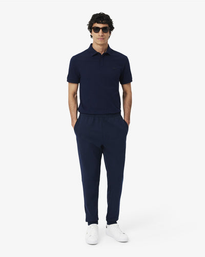 ชุดวอร์มผู้ชาย TAPERED LEG SWEATPANTS (Navy Blue • 166)